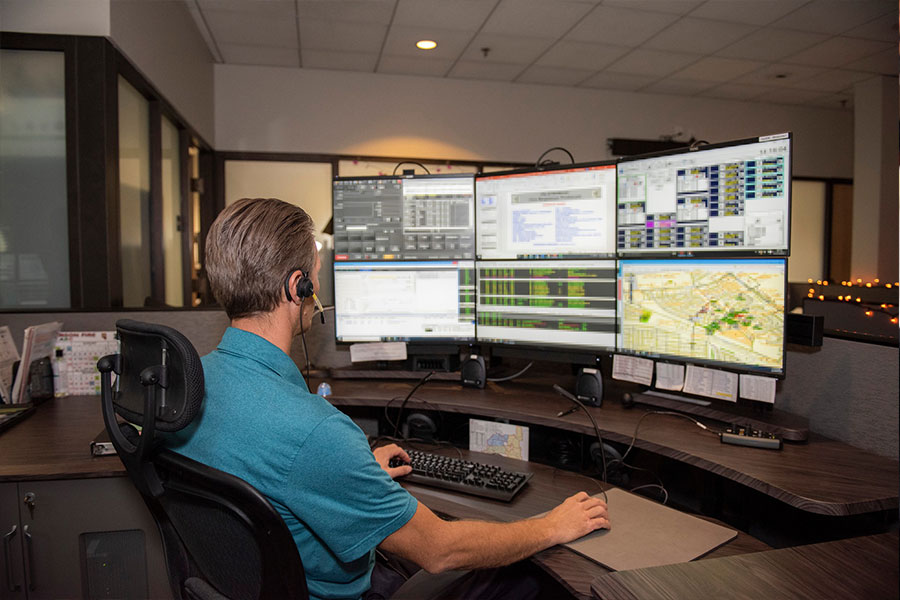 Friendly Henderson Police Dispatch Very Busy Doing his Job in a Photo