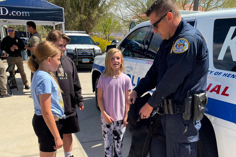 Friendly Henderson Police Officer Talking To Kids